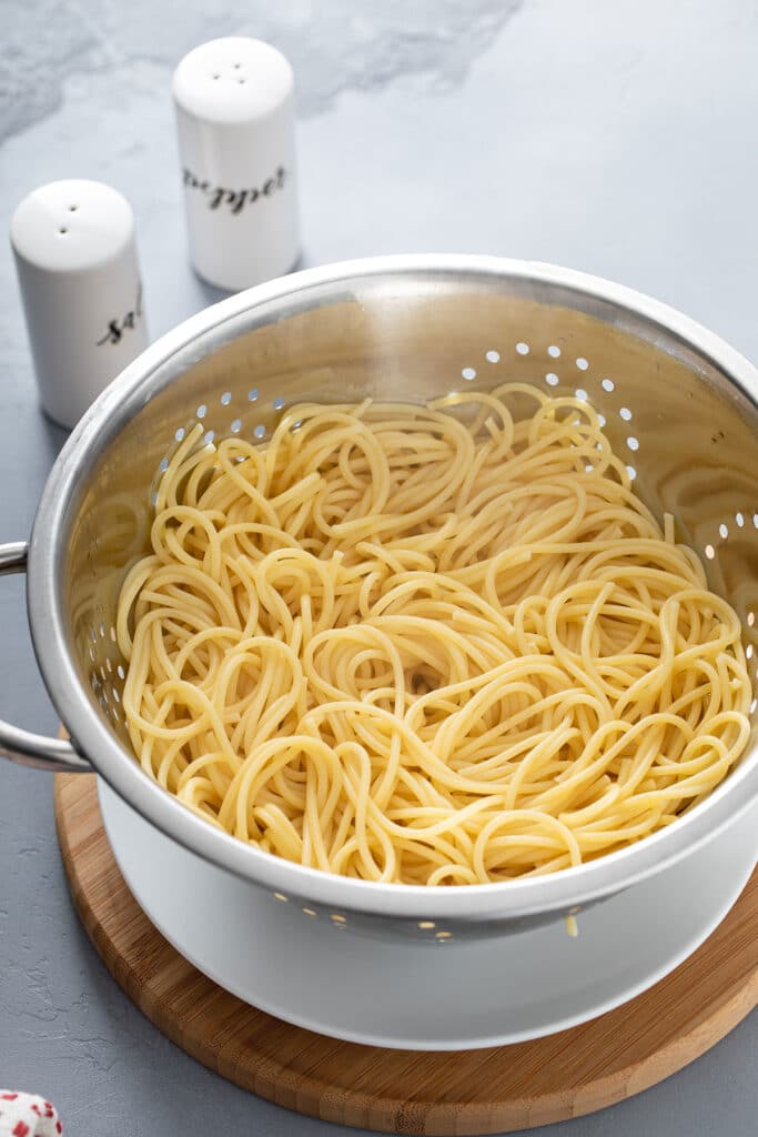 Pasta drained from pot and kept warm 