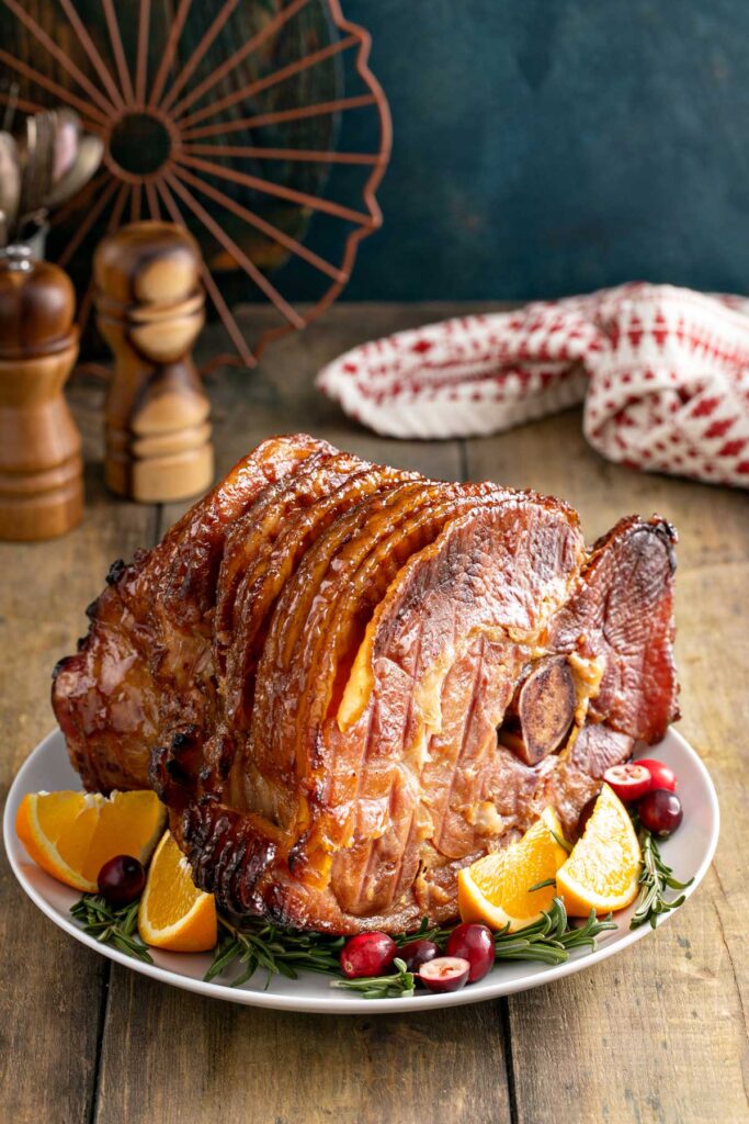 Spiral Ham caramelized with brown sugar, honey and spices served on a platter.