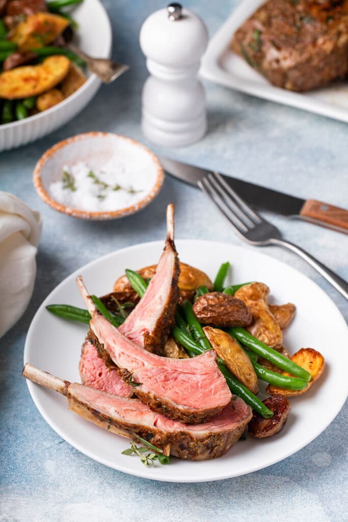 Individually cut lamb chops served with roasted potatoes and green beans