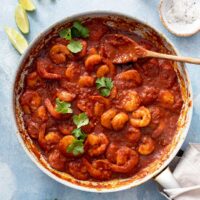 Succulent spicy shrimp in tomato-chile sauce in a skillet