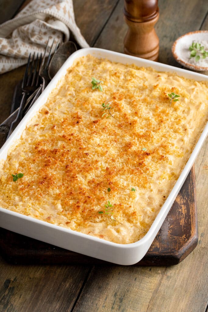 A baking pan full of Baked Mac and Cheese with crispy topping.