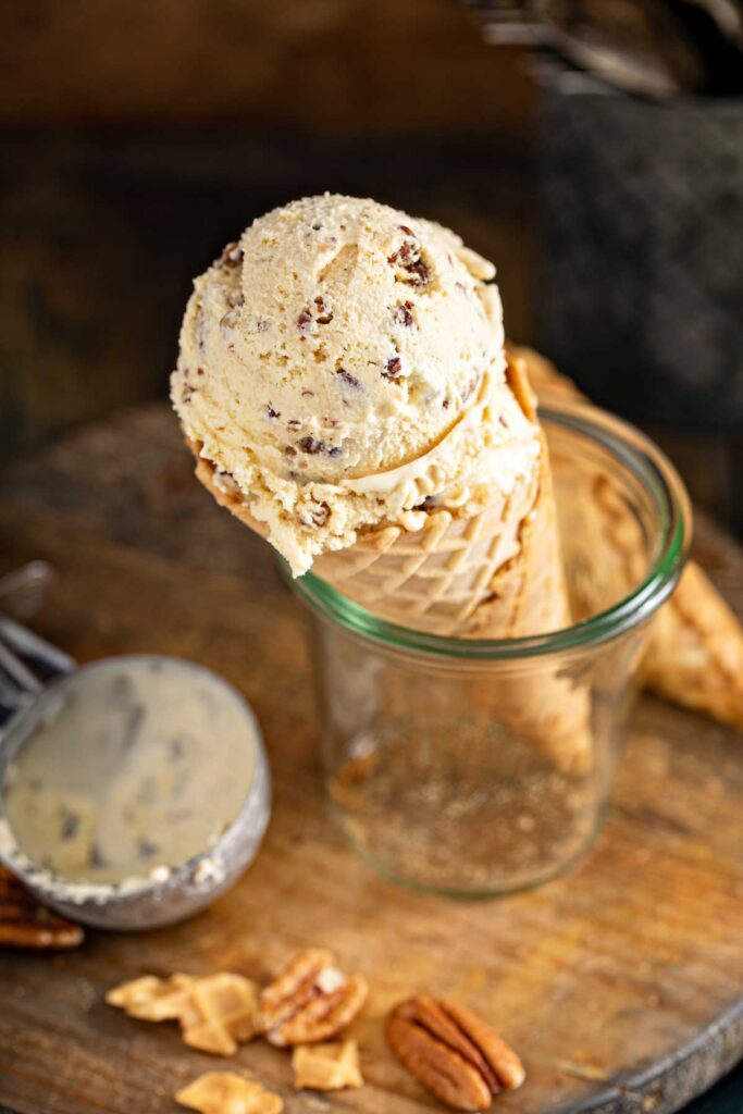 An ice cream cone in a glass jar.