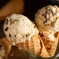 Waffle cones with butter pecan ice cream scoops