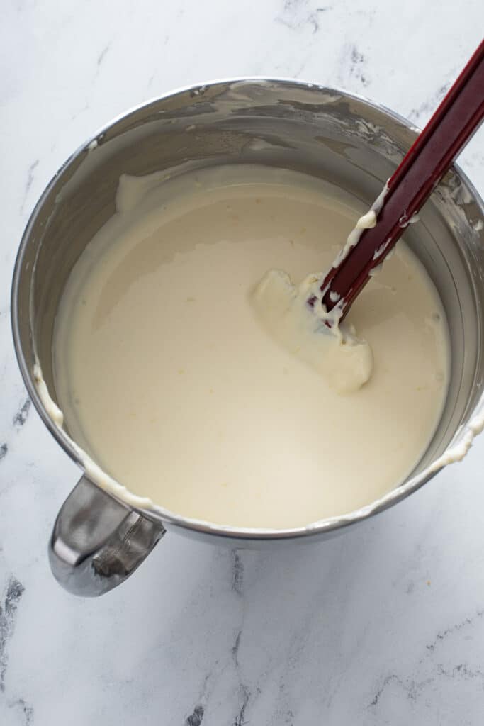 Delicious creamy cheesecake filling in mixing bowl ready to be poured into into crust 