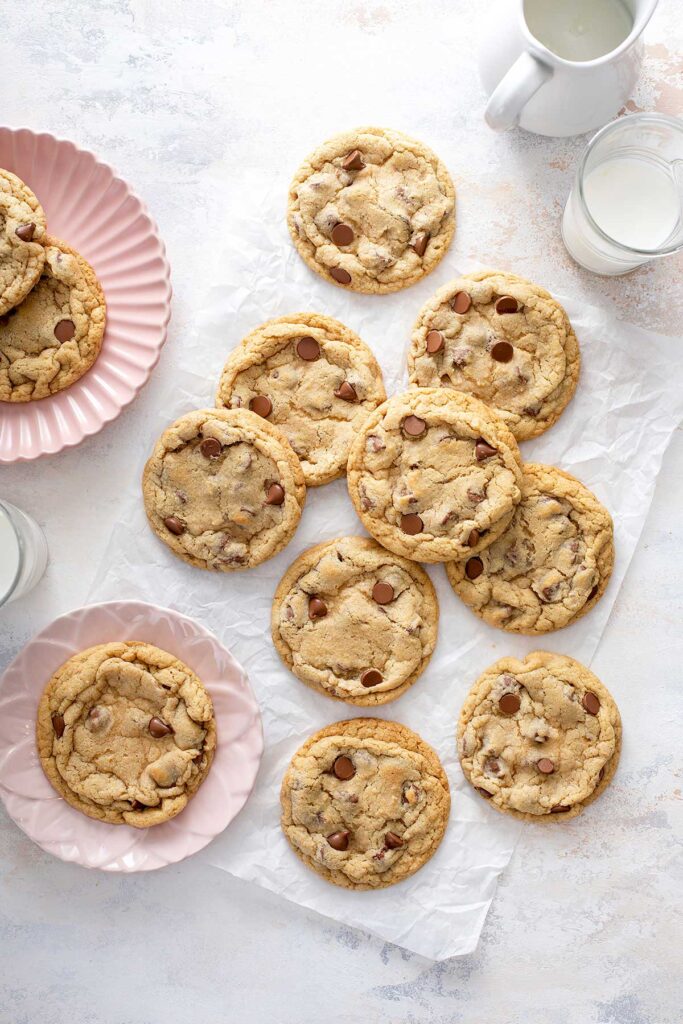 Crumbl chocolate chip cookies served on pink plates