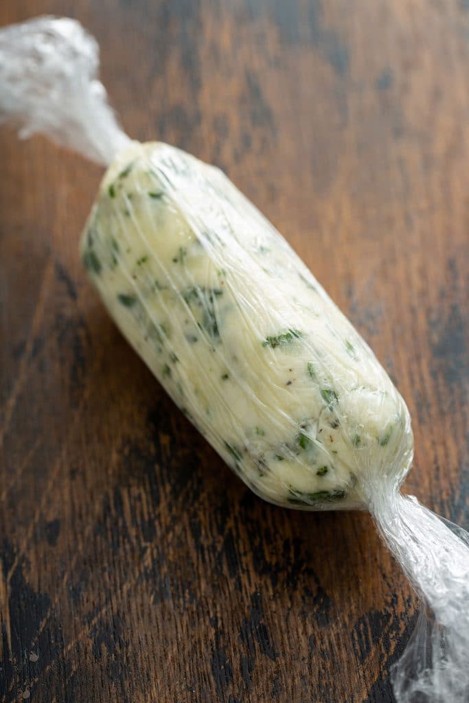 garlic herb butter wrapped in plastic