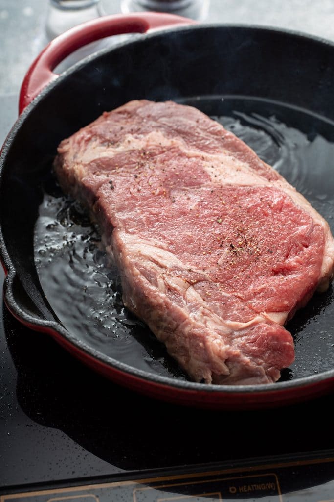 rib eye steak on a cast iron skillet