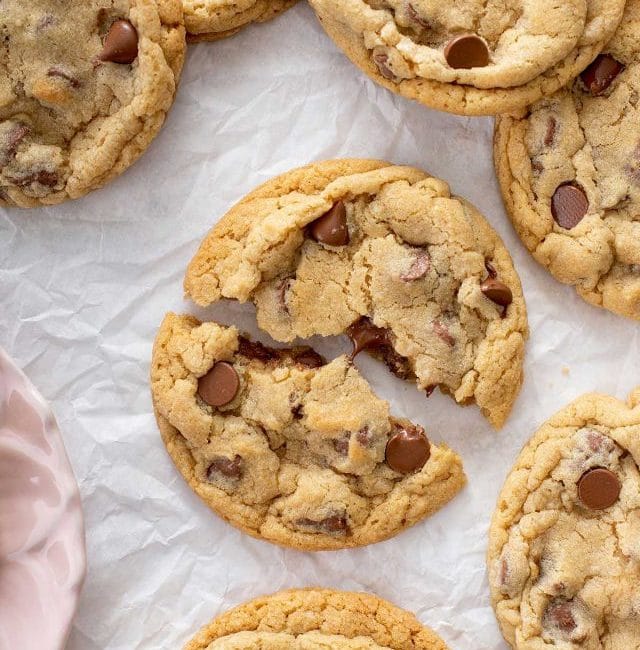 Copycat crumbl chocolate chip cookies on a piece of parchment paper.