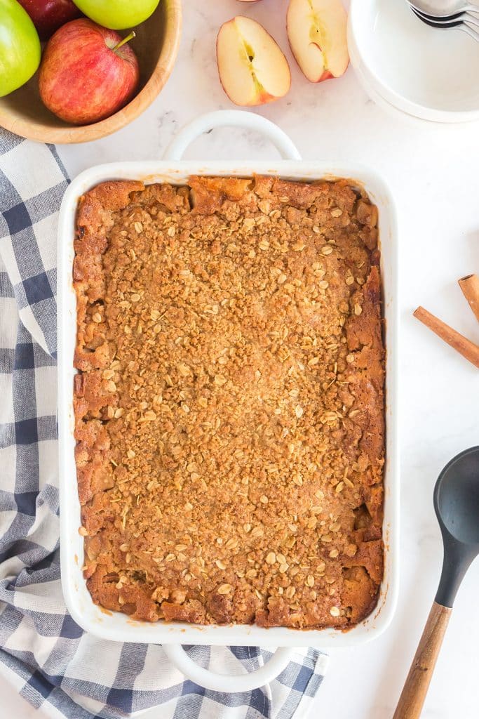 baked apple crisp in a white baking dish 