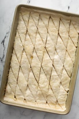 Unbaked Greek baklava in a baking pan