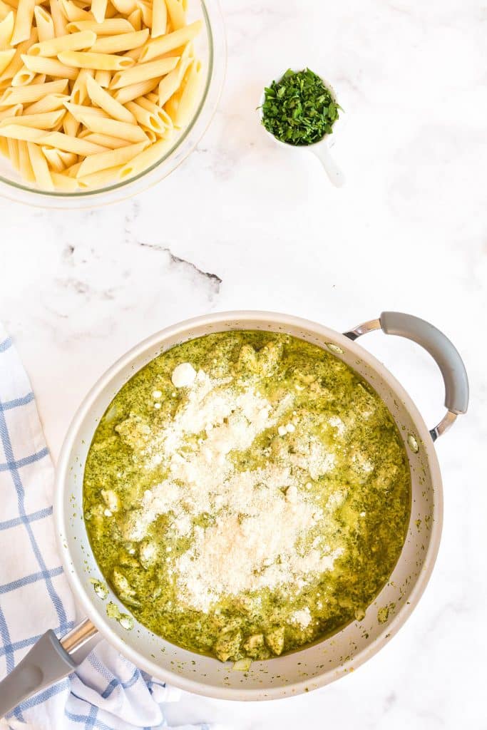 parmesan cheese over the chicken pesto sauce