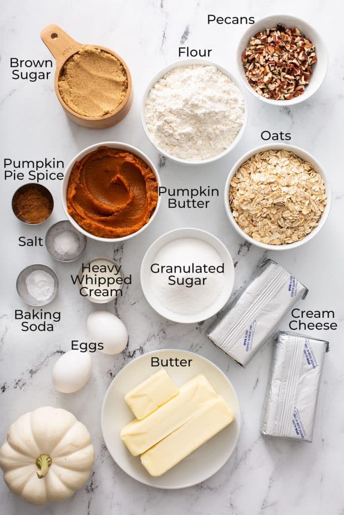 Ingredients to make swirled pumpkin cheesecake bars