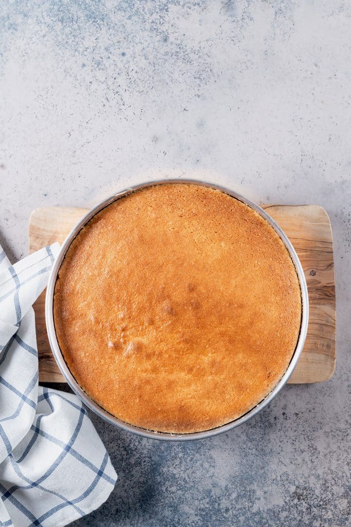 apple upside-down cake on a cake pan.