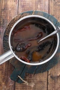 dried chiles and broth in a saucepan