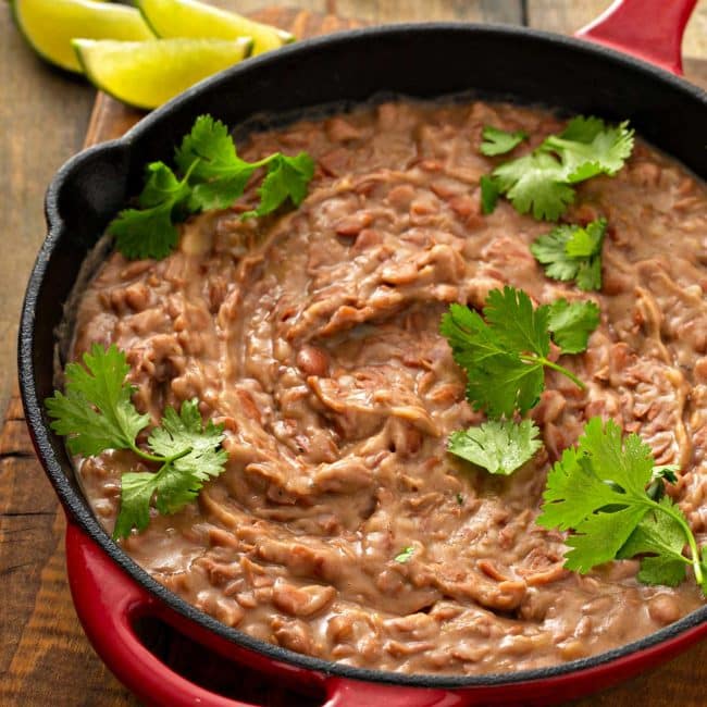 A skillet with homemade refried beans