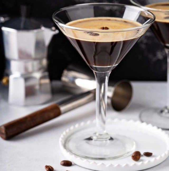 Espresso coffee martini served in a martini glass and garnished with coffee beans