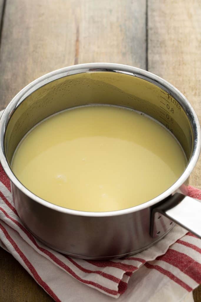 Milk, butter and water warming up in a saucepan