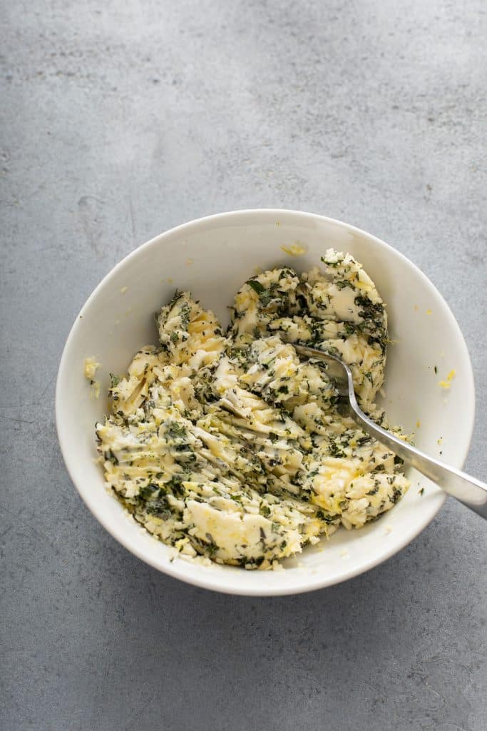 Herb butter mixed in a small bowl