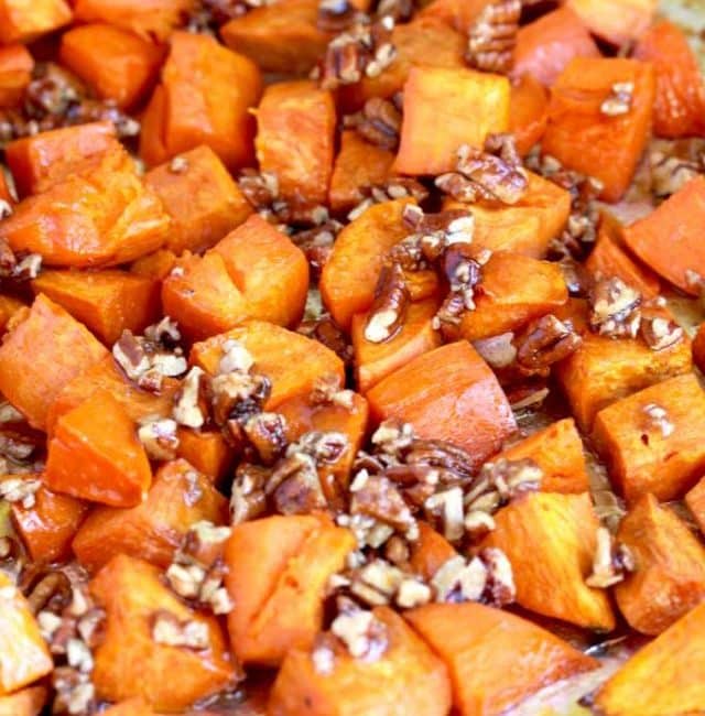 candied sweet potatoes and pecans on a baking tray