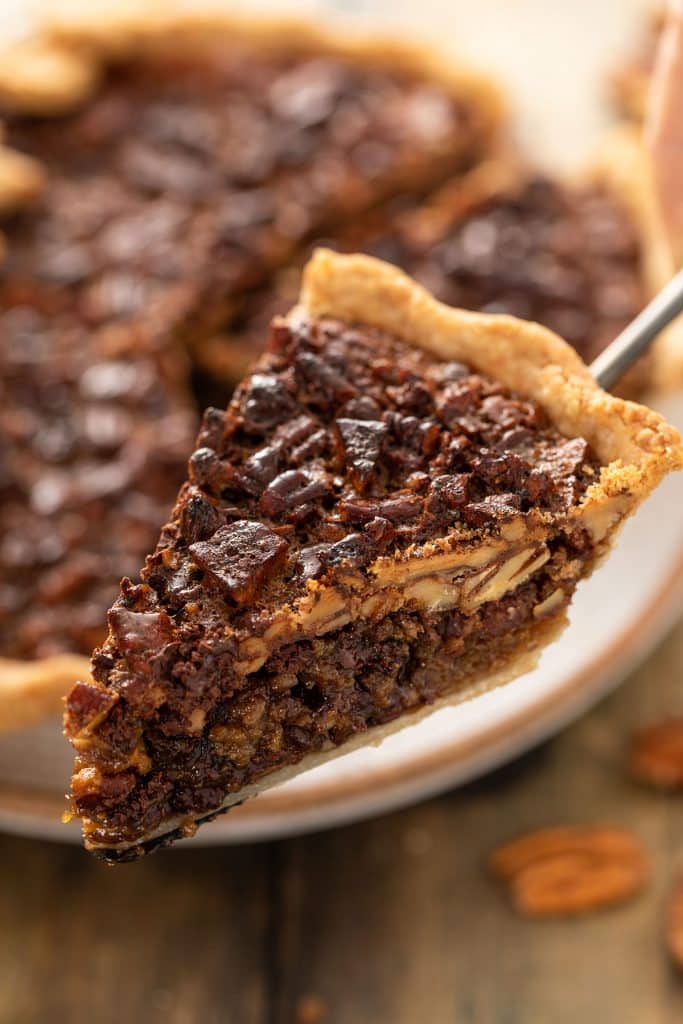 Close up view of a slice of Chocolate Pecan Pie 