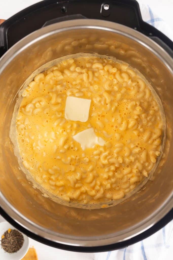 cheesy macaroni pasta with pieces of butter