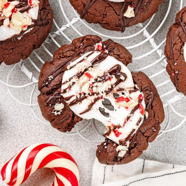 Top view of a Peppermint Hot Chocolate Cookie cut in half showing the melted marshmallow on top.
