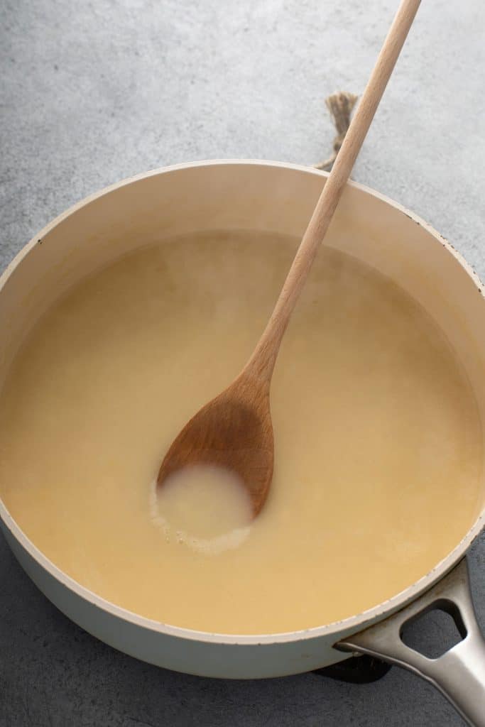 Smooth and silky turkey gravy in a pan