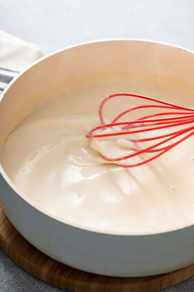 Creamy white sauce in a saucepan