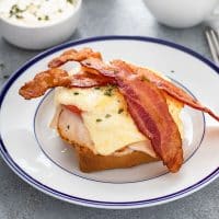 Kentucky hot brown sandwich with turkey served on a plate