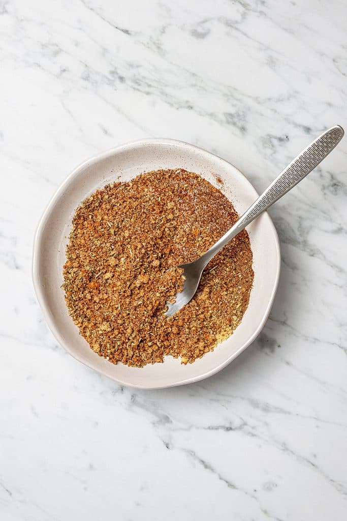 spice rub in a small bowl with a spoon