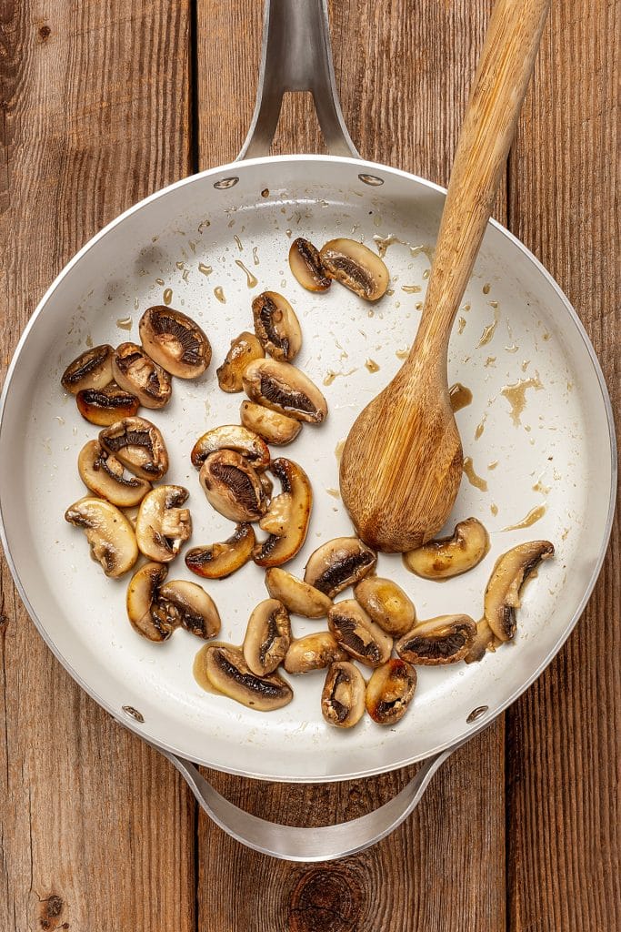 Golden brown sautéed  mushrooms in a skillet.