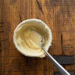Butter and flour mixed together in a small white bowl.
