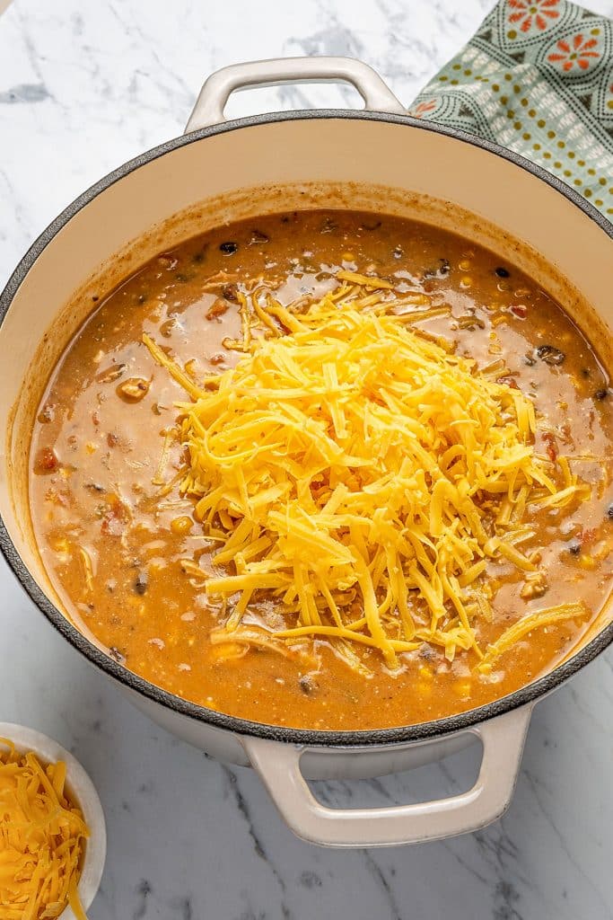 shredded cheddar cheese over the chicken enchilada soup