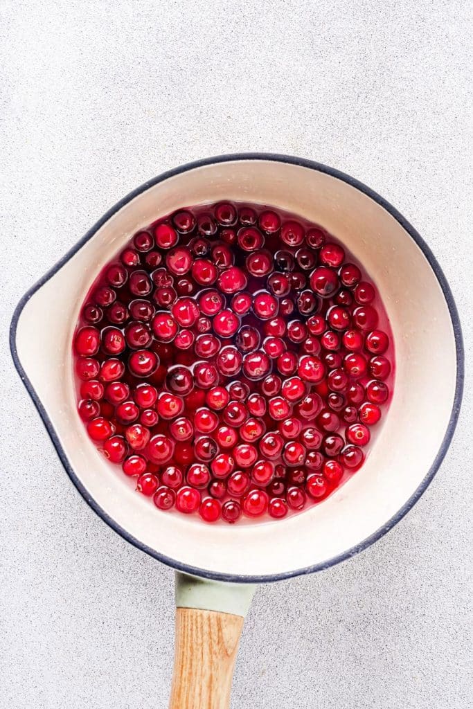 Cranberries, sugar and water in a saucepan
