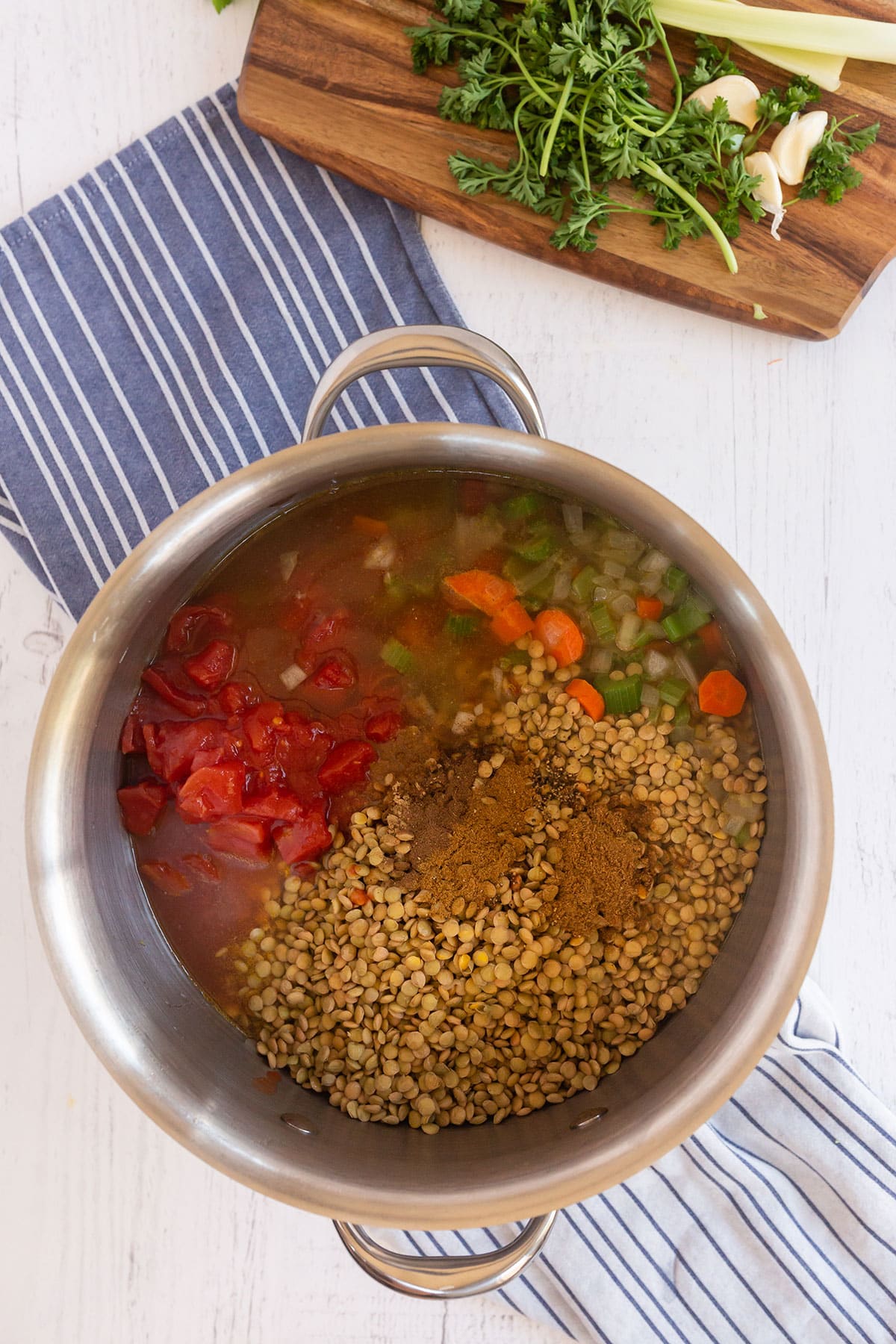 lentils, tomatoes, broth, coriander, cumin, ground black pepper, all spice and ginger in a pot