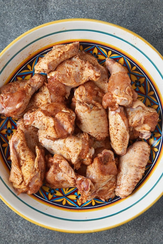 seasoned chicken wings in a bowl