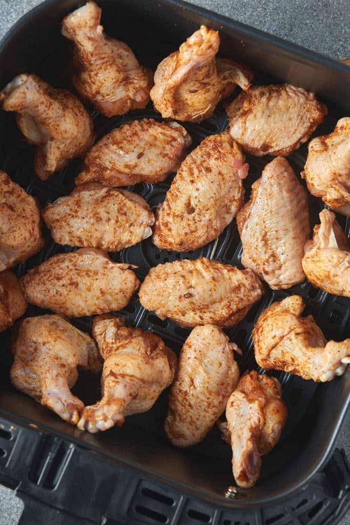 raw chicken wings in an air fryer