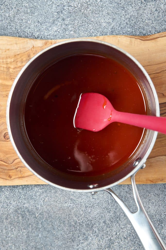 cooking bbq sauce in a sauce pan