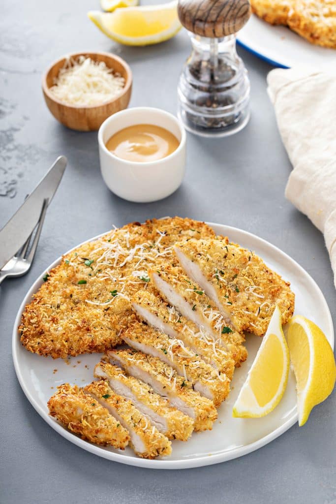 Crispy chicken breast cutlets cut into slices