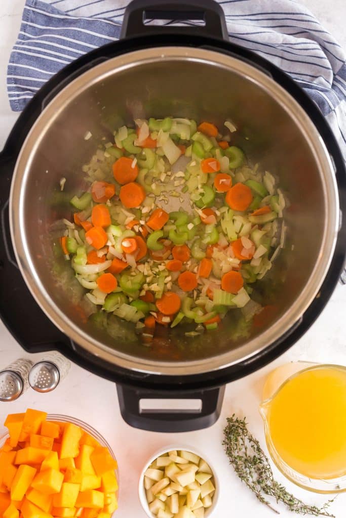sautéing onions, carrots and celery in an Instant Pot
