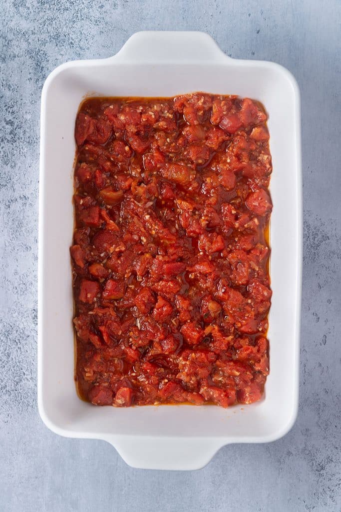 the tomato and honey sauce on a white baking dish