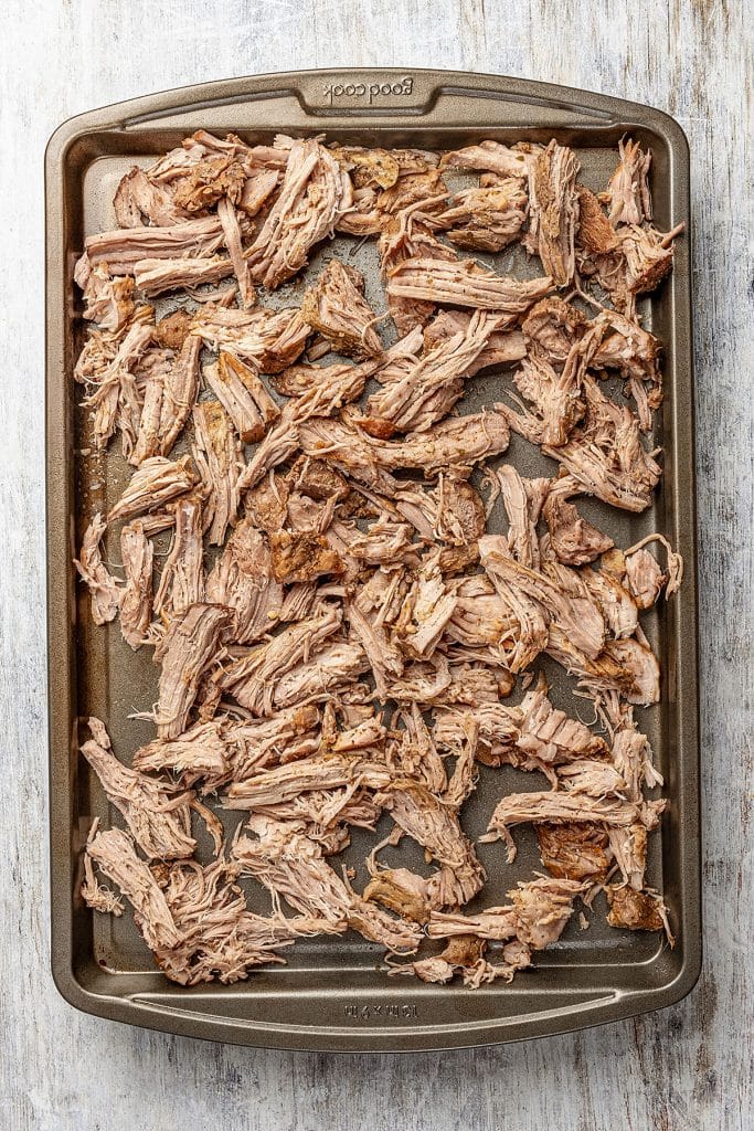 shredded pork on a sheet pan