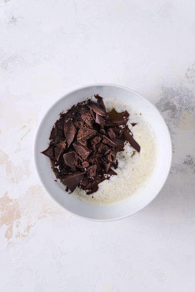 Melted butter and cut up chocolate in a bowl