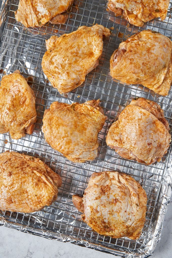 Marinated pollo asado on a wire rack