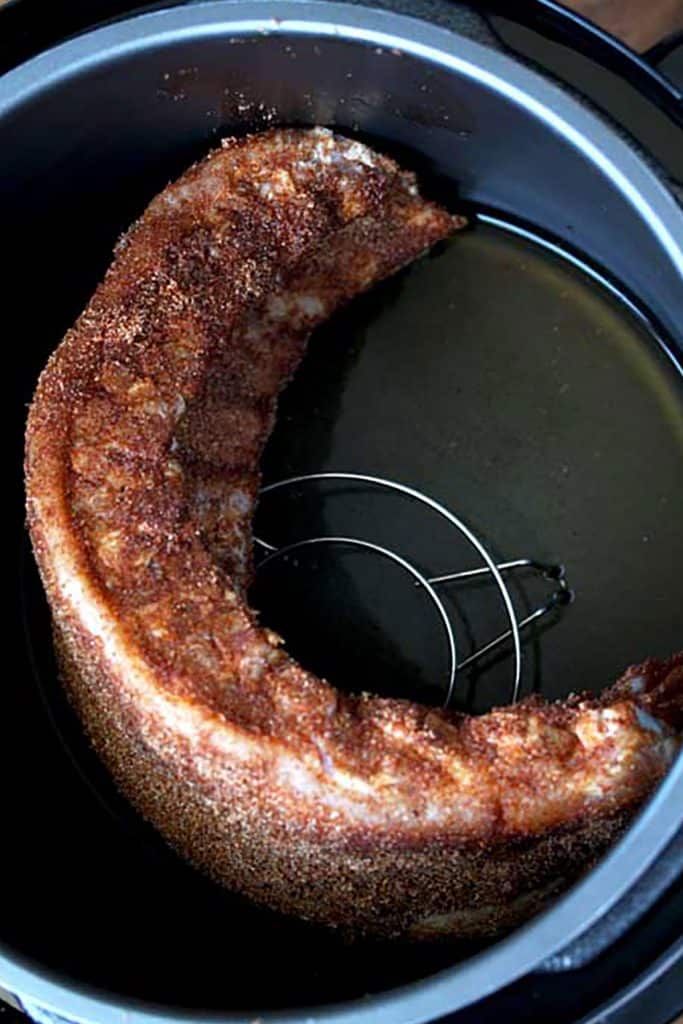 A rack of ribs inside an instant pot