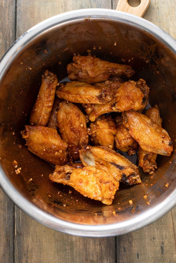 baked wings tossed with the sauce 