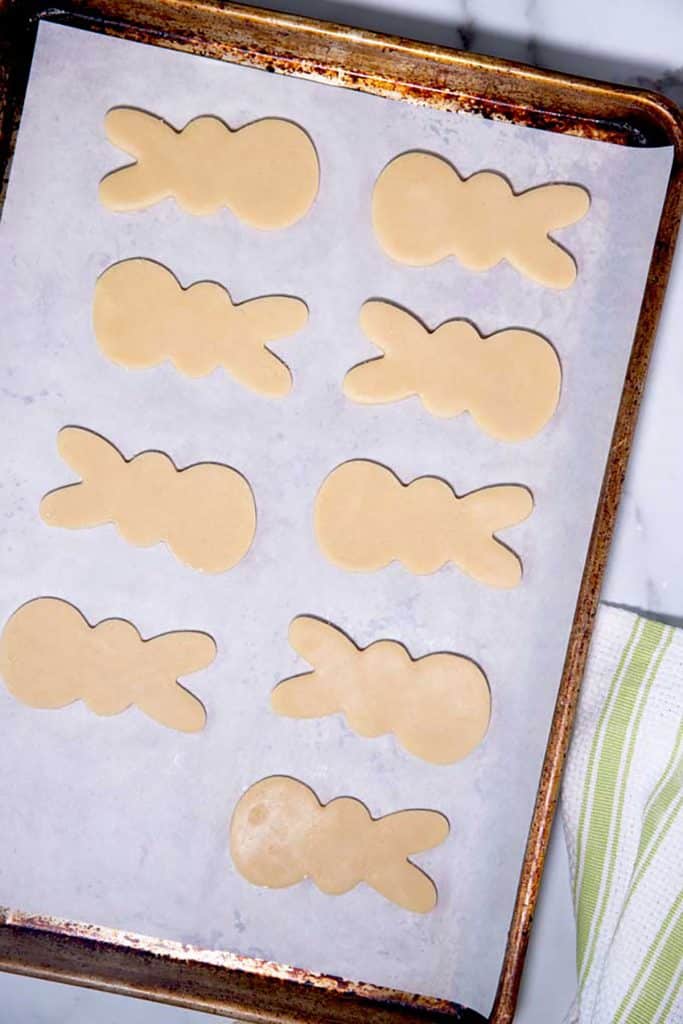 bunny cookie dough lined up on a baking tray