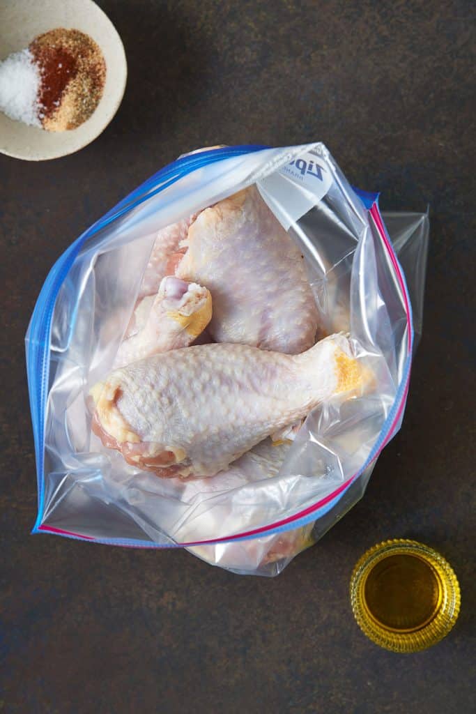 Raw Chicken drumsticks in a resealable bag