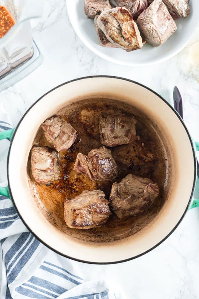 golden brown beef chunks in a pot