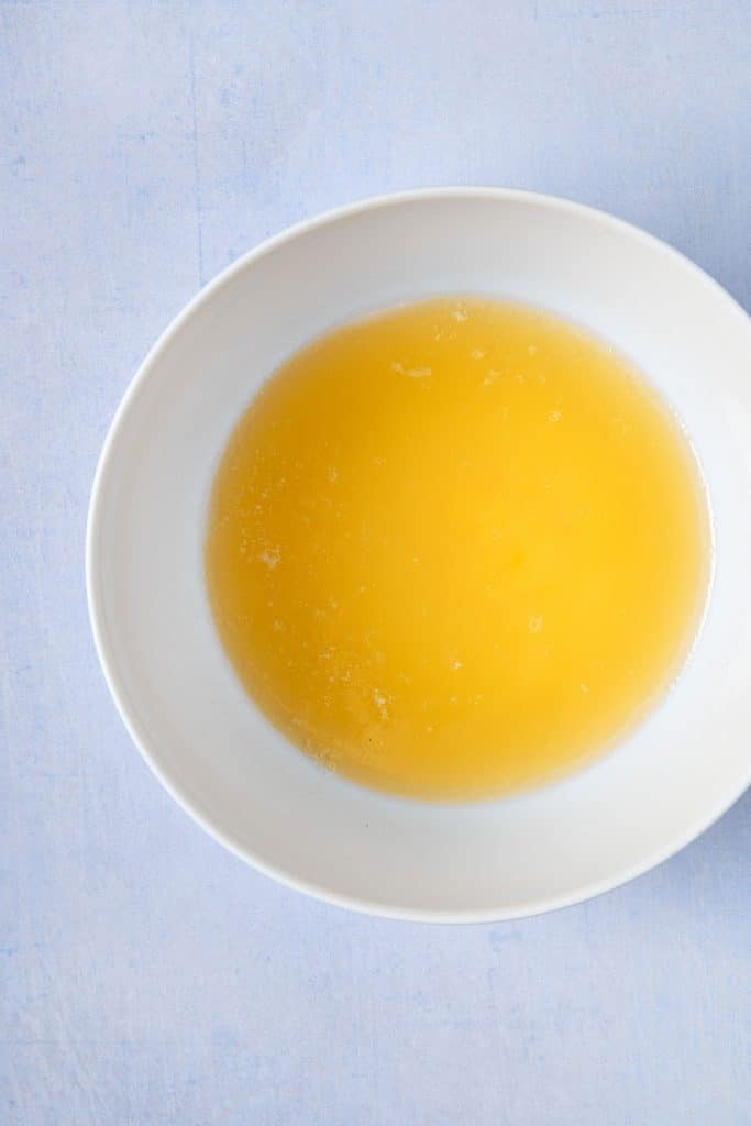 Melted butter in a white bowl
